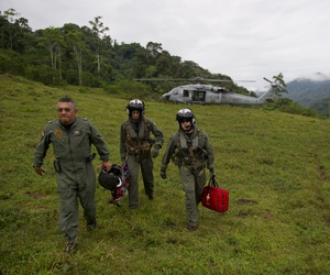 Costa Rica Police Air Patrol Officer Capt. George Lozano, left, Naval Air Crewman 3rd Class Joe Wainscott and Chief Naval Air Crewman Justin Crowe head toward a village to assist an injured boy in Bajo, Blay, Costa Rica, during Continuing Promise 2011. Costa Rica Police Air Patrol Officer Capt. George Lozano, left, Naval Air Crewman 3rd Class Joe Wainscott and Chief Naval Air Crewman Justin Crowe head toward a village to assist an injured boy in Bajo, Blay, Costa Rica, during Continuing Promise 2011.