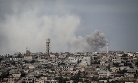 In this Sept. 19, 2013 photo, smoke rises after a TNT bomb was thrown from a helicopter, hitting a rebel position during heavy fighting between troops loyal to president Bashar Assad and opposition fighters, in the Idlib province countryside, Syria. In this Sept. 19, 2013 photo, smoke rises after a TNT bomb was thrown from a helicopter, hitting a rebel position during heavy fighting between troops loyal to president Bashar Assad and opposition fighters, in the Idlib province countryside, Syria.