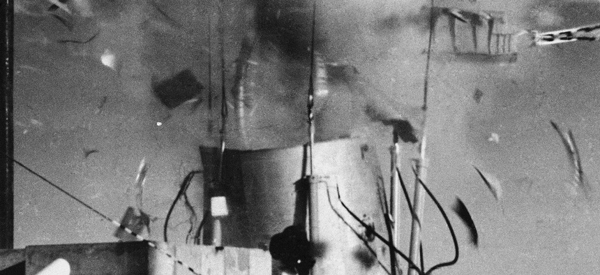 A Titan 1, Booster Missile body, left, is blown apart, right, by a high-powered chemical laser fired from a distance of sixth-tenths of a mile during a test at the White Sands Missile range is New Mexico on Sept, 6, 1985.
