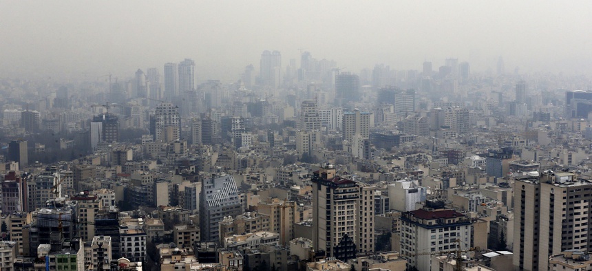 Air pollution blankets the skyline in Tehran, Iran, Sunday, Dec. 20, 2015.