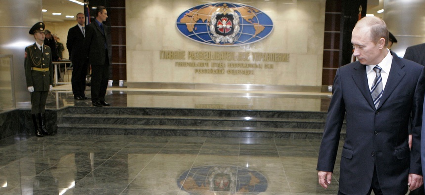n this Wednesday, Nov. 8, 2006 file photo, Russian President Vladimir Putin, right, walks through a hall in the building of the Main Directorate of the General Staff of the Armed Forces of Russia, also know as Russian intel service in Moscow.
