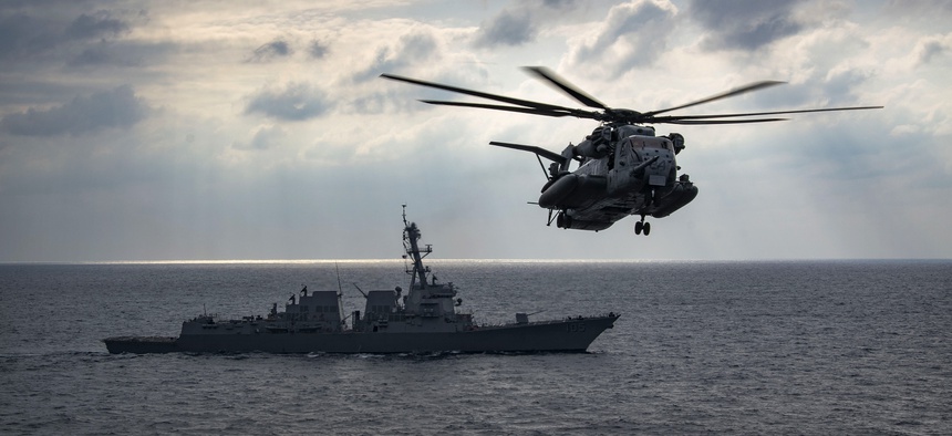 A CH-53E Sea Stallion attached to the "Dragons" of Marine Medium Tiltrotor Squadron (VMM) 265 prepares to land following a helicopter raid in the Philippine Sea, April 18, 2018.