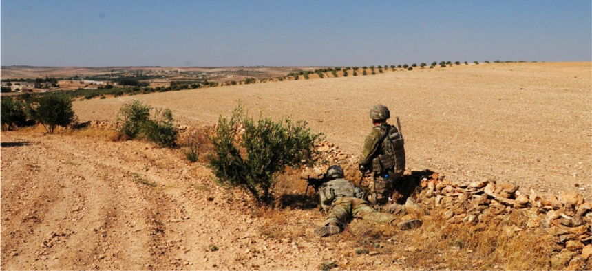 U.S. Soldiers provide security during an independent, coordinated patrol outside Manbij, Syria, August 19, 2018.