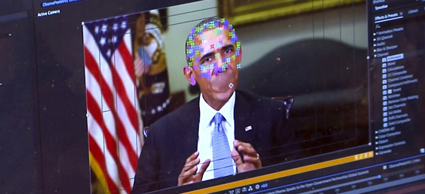 This image made from video of a fake video featuring former President Barack Obama shows elements of facial mapping used in new technology that lets anyone make videos of real people appearing to say things they've never said.