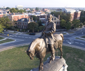 This Tuesday, Aug. 22, 2017, photo shows a view of the statue of Confederate General Robert E. Lee on Monument Avenue in Richmond, Va. This Tuesday, Aug. 22, 2017, photo shows a view of the statue of Confederate General Robert E. Lee on Monument Avenue in Richmond, Va.