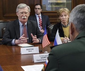 U.S. National Security Adviser John Bolton, left, gestures while speaking to Russian Defense Minister Sergei Shoigu, back to a camera, during their meeting in Moscow, Russia, Tuesday, Oct. 23, 2018. U.S. National Security Adviser John Bolton, left, gestures while speaking to Russian Defense Minister Sergei Shoigu, back to a camera, during their meeting in Moscow, Russia, Tuesday, Oct. 23, 2018.