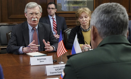 U.S. National Security Adviser John Bolton, left, gestures while speaking to Russian Defense Minister Sergei Shoigu, back to a camera, during their meeting in Moscow, Russia, Tuesday, Oct. 23, 2018. U.S. National Security Adviser John Bolton, left, gestures while speaking to Russian Defense Minister Sergei Shoigu, back to a camera, during their meeting in Moscow, Russia, Tuesday, Oct. 23, 2018.