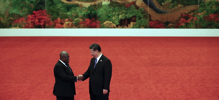 Ghana's President Nana Akufo-Addo, left, shakes hands with Chinese President Xi Jinping during the Forum on China-Africa Cooperation held at the Great Hall of the People in Beijing, Monday, Sept. 3, 2018.