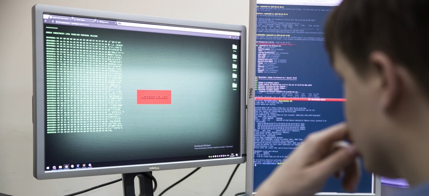 An employee of Global Cyber Security Company Group-IB develops a computer code in an office in Moscow, Russia, Wednesday, Oct. 25, 2017.