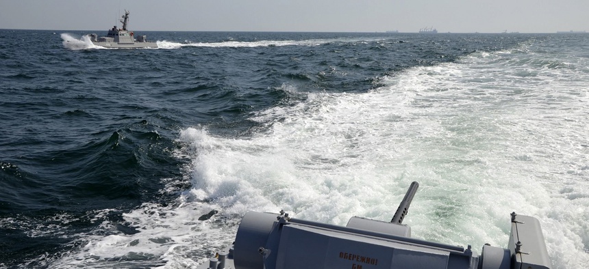 In this file photo taken and distributed by Ukrainian Navy Press Service on Sunday, Nov. 25, 2018, two Ukrainian forces navy ships are seen near Crimea.