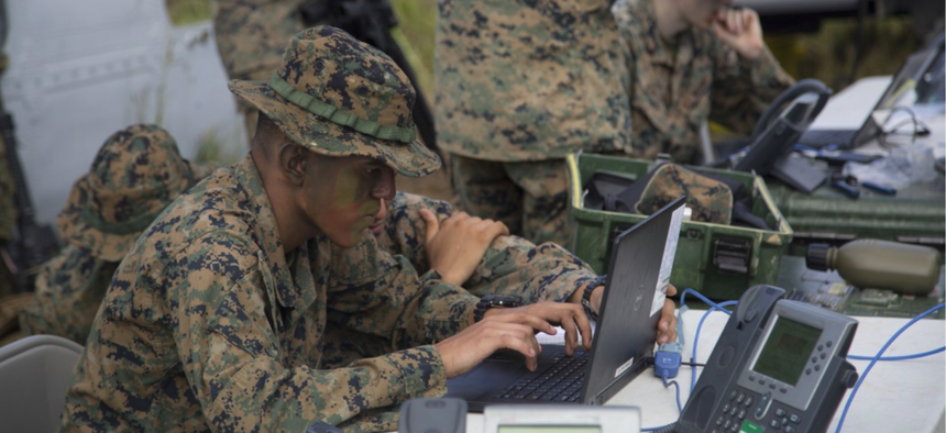 U.S. Marines compete against each other in a race to set up a working communication system during an exercise at the Jungle Warfare Training Center in Okinawa, Japan, Oct. 18, 2018.