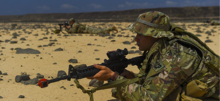 U.S. service members assigned to the Combined Joint Task Force - Horn of Africa keep watch as their platoon set ups an objective rally point on the first day of a French Desert Commando Course at the Djibouti Range Complex near Arta, Djibouti, Nov. 26, 20