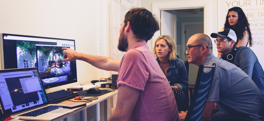 Dillon Morris and Jayson Tang reviewing footage from Nokia OZO on an Apple MacBook Pro shooting a short film at Garage Stories VR Hackathon in Silicon Valley on June 4, 2017.