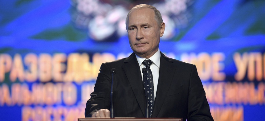 President Vladimir Putin speaks at a meeting with officers of Russia's military intelligence, GRU in Moscow, Russia, Friday, Nov. 2, 2018.