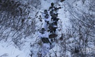 In this Tuesday, Dec. 19, 2017, file photo, South Korean and U.S. Marines from III-Marine Expeditionary Force from Okinawa, Japan, patrol on the snow during their joint military winter exercise in Pyeongchang, South Korea.