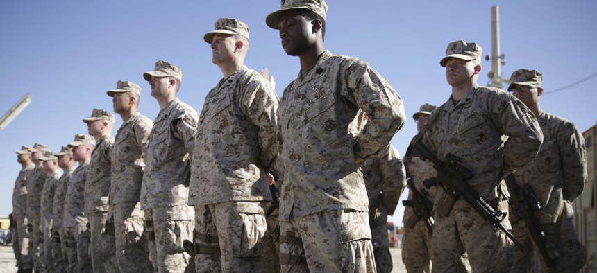 In this Jan. 15, 2018 file photo, U.S. Marines stand guard during the change of command ceremony at Task Force Southwest military field in Shorab military camp of Helmand province, Afghanistan.