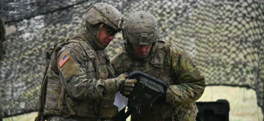 U.S. Soldiers assigned to Field Artillery Squadron, 2nd Cavalry Regiment, prepare to fire a M777 towed 155 mm howitzer during the Table VI Live Fire Exercise at the 7th Army Training Command’s Grafenwoehr Training Area, Germany, Nov. 30, 2018.