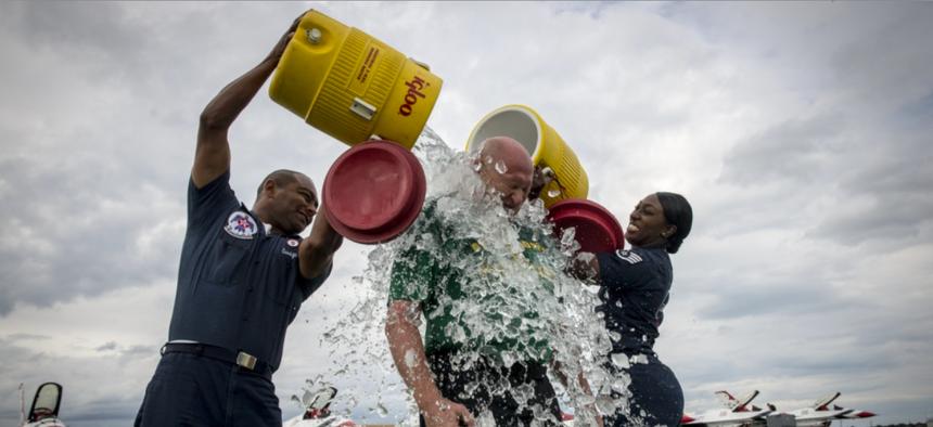 Air Force servicemembers do their part to raise awareness for ALS with the Ice Bucket Challenge in 2014.