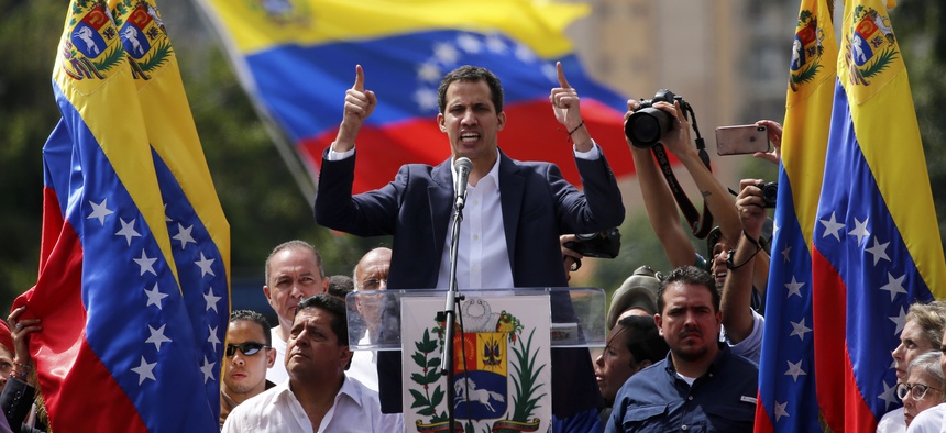 Juan Guaido, head of Venezuela's opposition-run congress, declares himself interim president of the nation until elections can be held during a rally demanding President Nicolas Maduro's resignation in Caracas, Venezuela, Wednesday, Jan. 23, 2019.