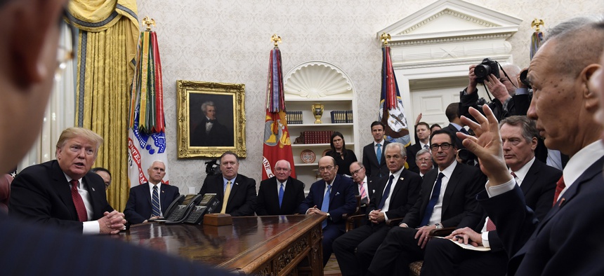 President Donald Trump, left, meets with Chinese Vice Premier Liu He, far right, at the White House in Washington, Thursday, Jan. 31, 2019.