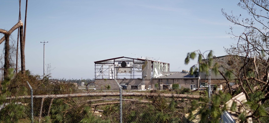 An airplane hangar at Tyndall Air Force Base, which was not included in DOD's climate change report, is damaged from hurricane Michael in Panama City, Fla., Thursday, Oct. 11, 2018.