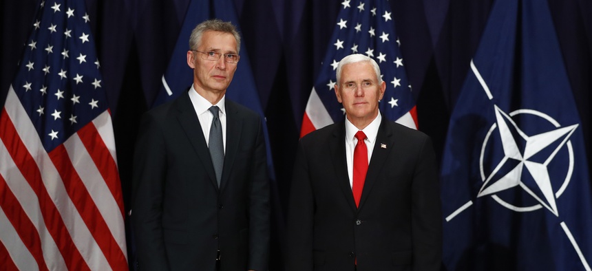 United States Vice President Mike Pence, right, and NATO's Secretary General Jens Stoltenberg, left, pose for media during a bilateral meeting at the Munich Security Conference in Munich, Germany, Saturday, Feb. 16, 2019.