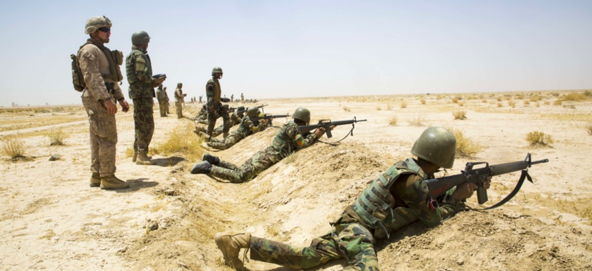 Afghan National Army (ANA) 215th Corps soldiers shoot simulated enemy targets during a live-fire range supervised by ANA instructors and U.S. Marine Corps advisors with Task Force Southwest at Camp Shorabak.
