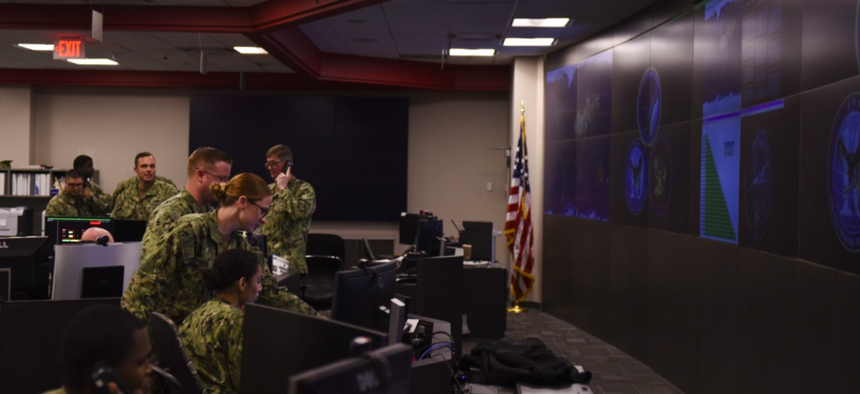 Sailors stand watch in the Fleet Operations Center at the headquarters of U.S. Fleet Cyber Command/U.S. 10th Fleet (FCC/C10F).