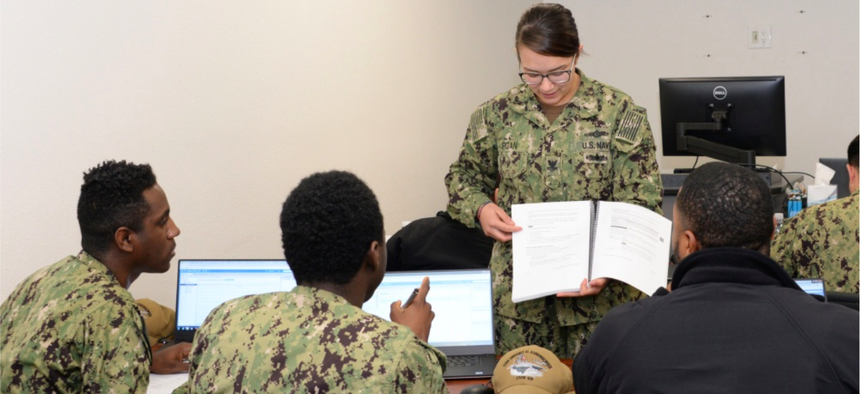 Electronics Technician 2nd Class Makayla Burgan, Security Plus Lead Instructor teaches fleet students VMWare software applications for the shipboard Consolidated Afloat Network Enterprise Services (CANES) system.