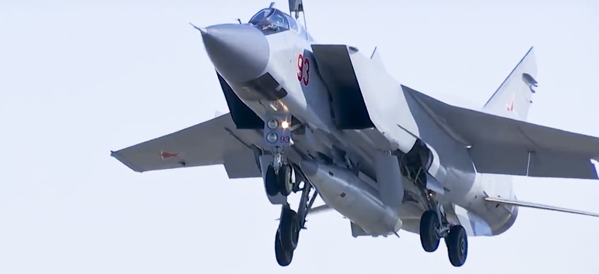 In this photo made from the footage taken from Russian Defense Ministry official web site on Sunday, March 11, 2018, a MiG-31 fighter jet of the Russian air force carrying the new Kinzhal hypersonic missile takes off from an air base in southern Russia.