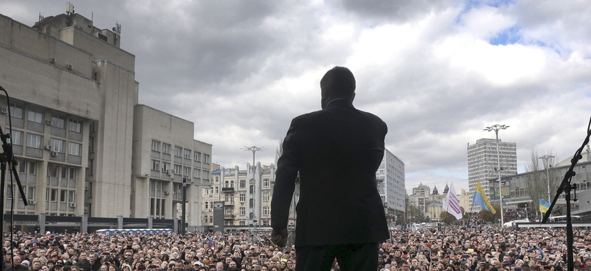 Ukrainian President Petro Poroshenko speaks to a crowd ahead of the presidential elections on April 21, at the Olympic stadium in Kiev, Ukraine, Sunday, April 14, 2019.