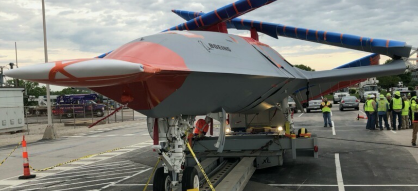 A prototype of the Navy’s new MQ-25 carrier-based drone is driven to its test airfield in Illinois.