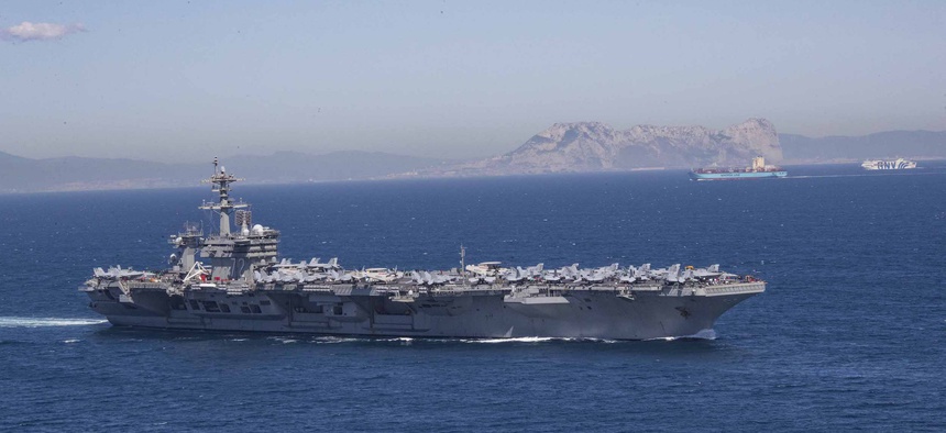 The Nimitz-class aircraft carrier USS Abraham Lincoln (CVN 72) transits the Strait of Gibraltar,