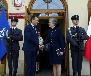 Air Force Secretary Heather Wilson greets Polish Defense Minister Mariusz Blaszczak in Warsaw.
