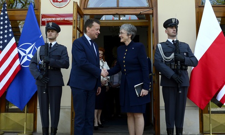 Air Force Secretary Heather Wilson greets Polish Defense Minister Mariusz Blaszczak in Warsaw.