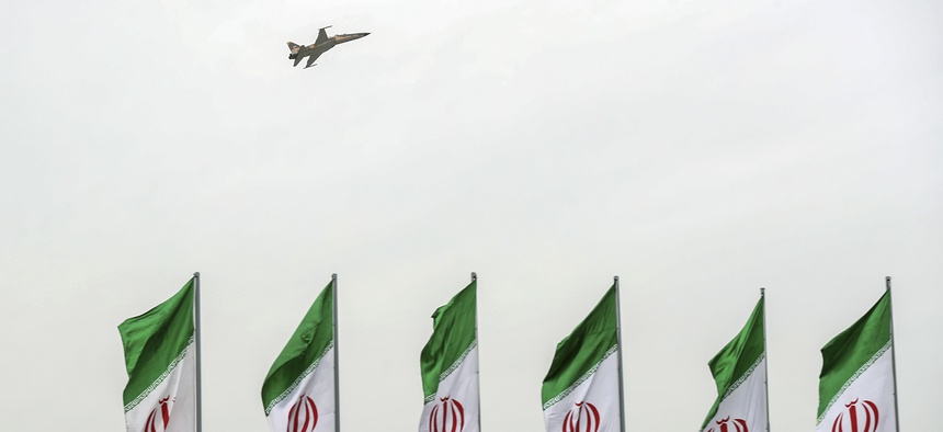 A fighter jet flies over Iranian flags during the army parade commemorating National Army Day in front of the shrine of the late revolutionary founder Ayatollah Khomeini, just outside Tehran, Iran, Thursday, April 18, 2019.