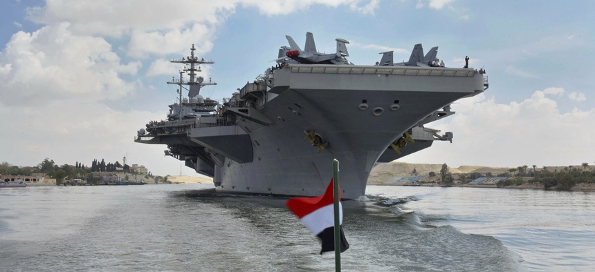The USS Abraham Lincoln sails south in the Suez canal near Ismailia, Thursday, May 9, 2019.