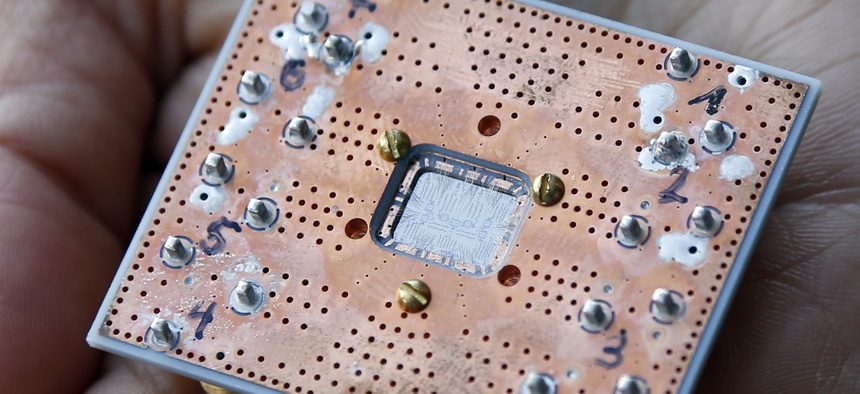 This Feb. 27, 2018, photo shows a seven cubit quantum device is seen at the IBM Thomas J. Watson Research Center in Yorktown Heights, N.Y.