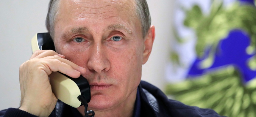 Russian President Vladimir Putin speaks over the phone with Turkish President Recep Tayyip Erdogan aboard the pipelaying vessel Pioneering Spirit in the Black Sea near Anapa, Russia, Friday, June 23, 2017.