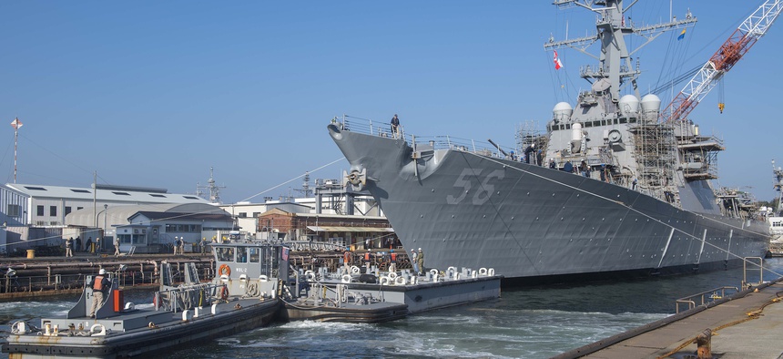 In this Nov. 27, 2018, photo, the Arleigh Burke-class guided missile destroyer USS John S. McCain leaves a Yokosuka dry dock after repairs following a collision that killed 10 U.S. sailors.