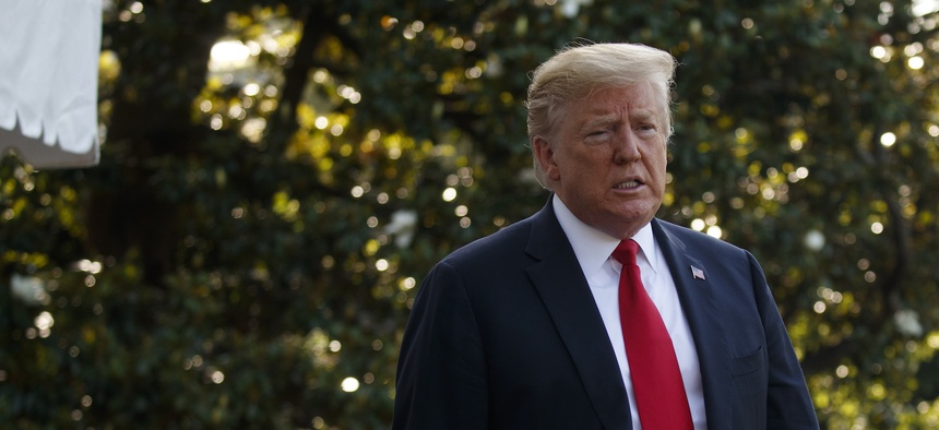 President Donald Trump talks with reporters before departing on Marine One for the Air Force Academy graduation ceremony, Thursday, May 30, 2019, in Washington.