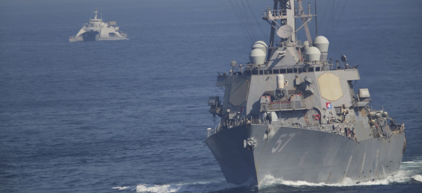 An Iranian Revolutionary Guard vessel, left, shadows the guided missile destroyer USS Mitscher on Dec. 21, 2018.