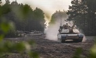 Soldiers aboard Army M1A2 Abrams tanks move out during an initial ready task force exercise at Johanna Range near Zagan, Poland, May 20, 2019.
