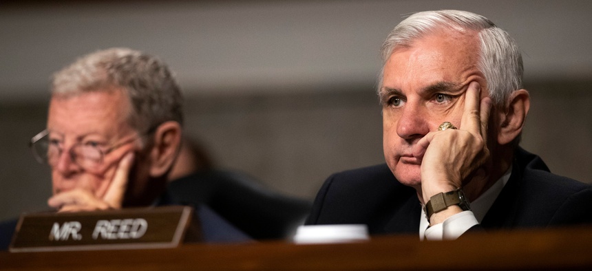 Senate Armed Services Committee Chairman Sen. James Inhofe, R-Okla., and ranking member Sen. Jack Reed, D-R.I., right, listen to Secretary of the Army Mark Esper during his confirmation hearing, July 16, 2019.