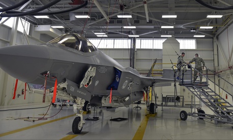 Airmen 1st Class Griffin Smith and William Manion, both 33rd Maintenance Squadron aircraft fuels system repairman apprentices, don safety gear to prepare an F-35A Lightning II for maintenance at Eglin Air Force Base, Fla., Jan. 13, 2016. 