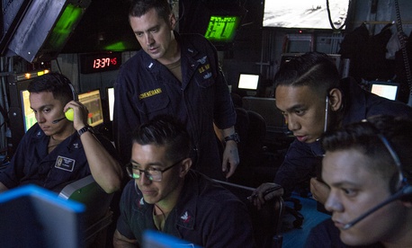 GULF OF ADEN (July 2, 2019) Sailors assigned to amphibious assault ship USS Boxer (LHD 4) observe flight operations on the display of an OD-220 radar from inside the amphibious air traffic control center. GULF OF ADEN (July 2, 2019) Sailors assigned to amphibious assault ship USS Boxer (LHD 4) observe flight operations on the display of an OD-220 radar from inside the amphibious air traffic control center.