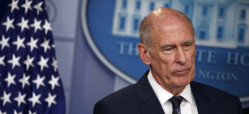 Director of National Intelligence Dan Coats listens during the daily press briefing at the White House, Thursday, Aug. 2, 2018, in Washington.