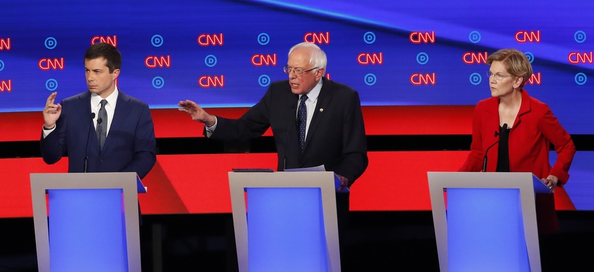 South Bend Mayor Pete Buttigieg, Sen. Bernie Sanders, I-Vt., and Sen. Elizabeth Warren, D-Mass., participate in the first of two Democratic presidential primary debates hosted by CNN Tuesday, July 30, 2019, in the Fox Theatre in Detroit.