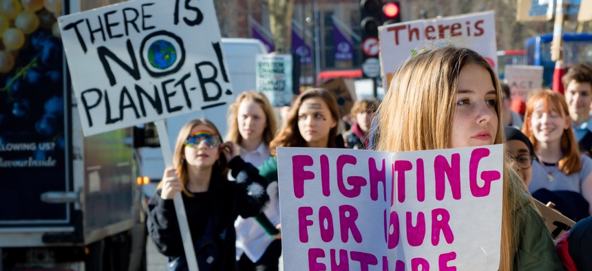 London, UK, February 15, 2019: Striking school aged children in central London over climate change holding placards.