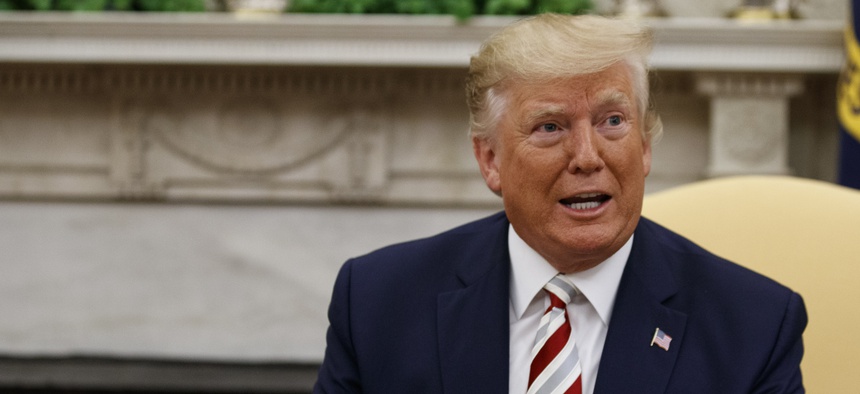 President Donald Trump expresses his desire to reduce U.S. forces in Afghanistan, in the Oval Office of the White House, Tuesday, Aug. 20, 2019, in Washington.